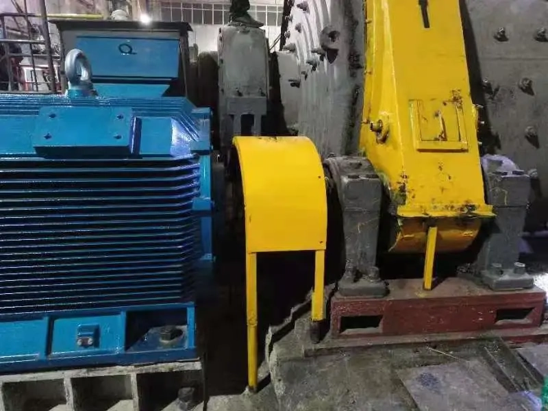 Industrial ball-mill drivetrain photographed at a plant
